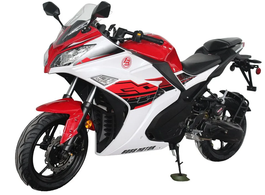 A red and white motorcycle is parked on the street.