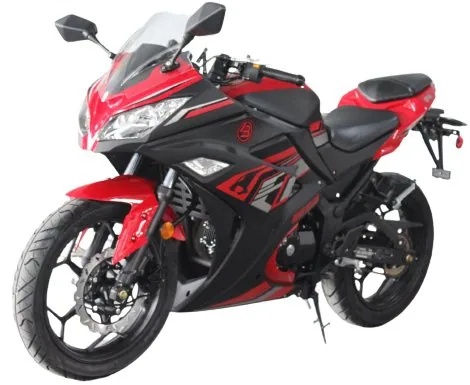 A red and black motorcycle is parked on the street.