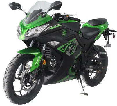 A green and black motorcycle is parked on the street.