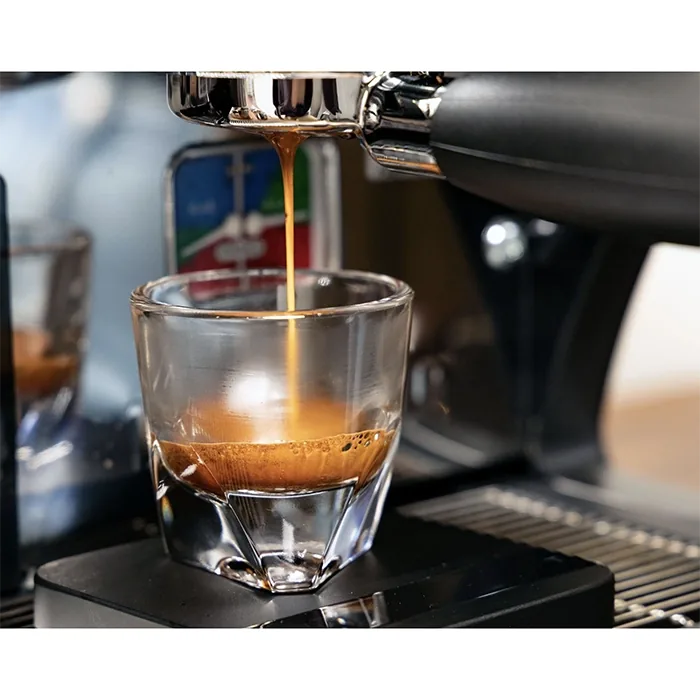 A hand pulling out the front-loading water reservoir of the LUCCA A53 Mini V2 Black