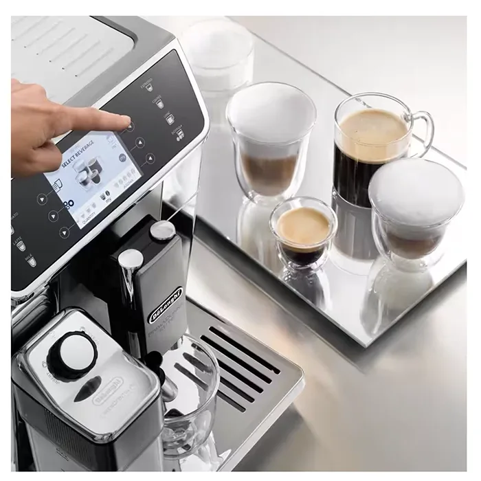 Close-up of the LatteCrema System milk carafe attached to the DeLonghi PrimaDonna Elite, highlighting its automatic frothing