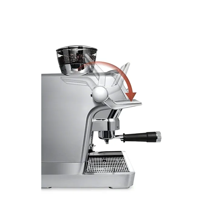 A hand using the My LatteArt System steam wand on the DeLonghi La Specialista Maestro for manual milk texturing