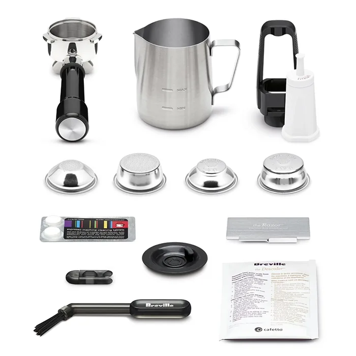 Close-up of the Breville Barista Touch Impress Black "Impress Puck System" automatically tamping coffee grounds in a portafilter