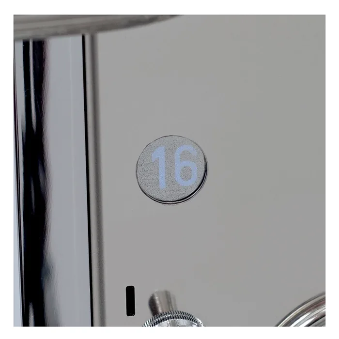 The Rocket Espresso Mozzafiato Cronometro V White accompanied by its included metal tamper and cleaning brush, showcasing its premium quality