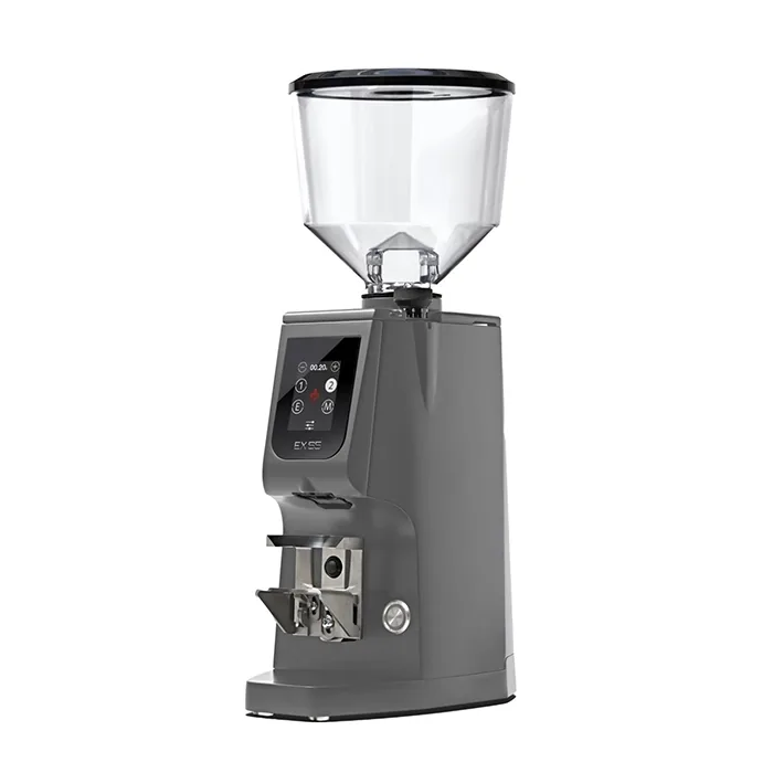 A sleek, Eureka Atom Excellence 65 Grey espresso grinder on a countertop, highlighting its sturdy build