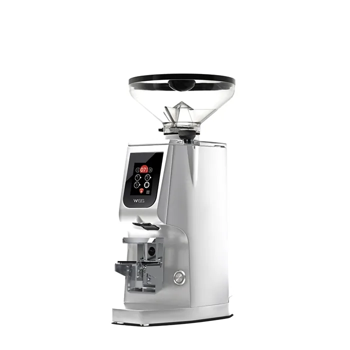 A sleek, Eureka Atom W 65 espresso grinder Chrome on a counter, highlighting its compact design