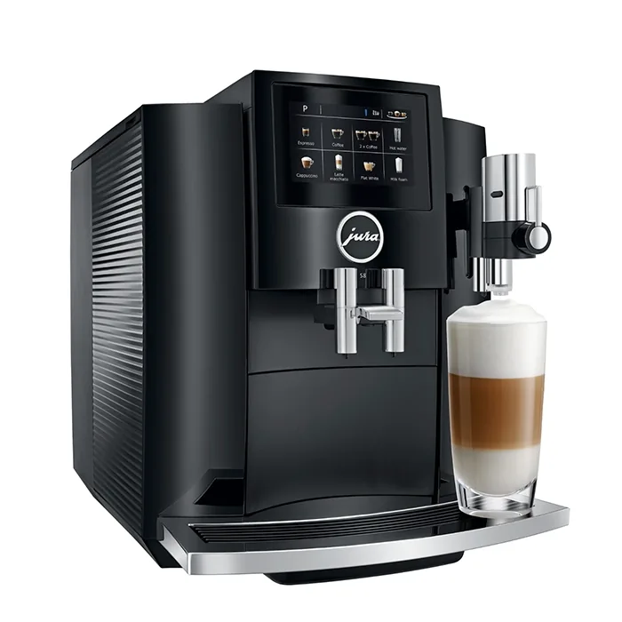A sleek JURA S8 espresso machine black, displaying its large color touchscreen and a coffee cup ready for brewing