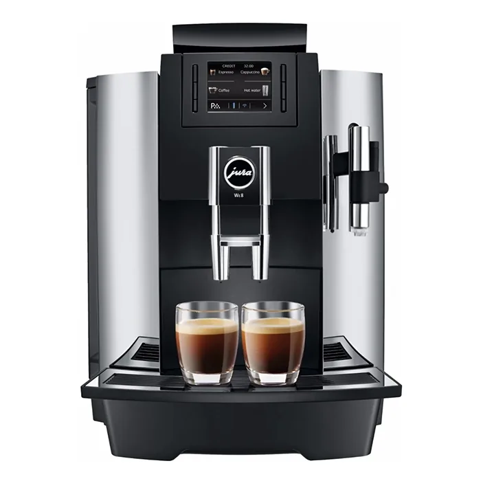 A sleek JURA WE8 coffee machine with its color LCD display illuminated, showcasing a prepared drink