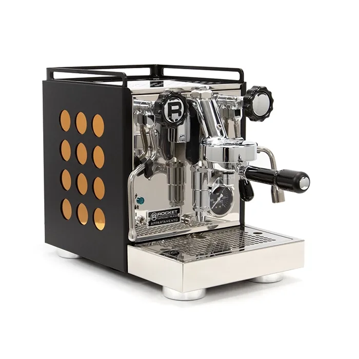 A matte black Rocket Espresso Appartamento Serie Nera with copper accents, highlighting its polka dot design