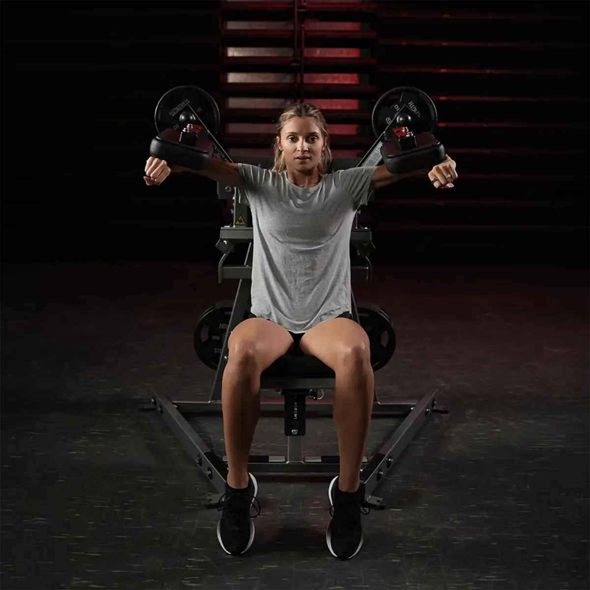 Hammer Strength shoulder raise machine with integrated weight storage