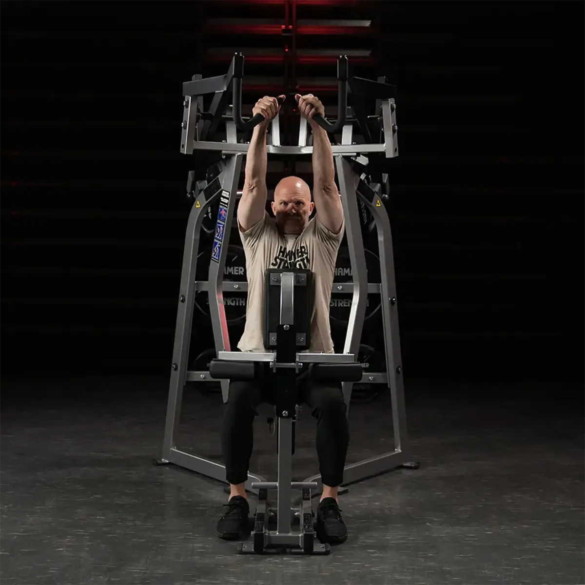 Hammer Strength Plate-loaded high row with overhand grip and storage horns