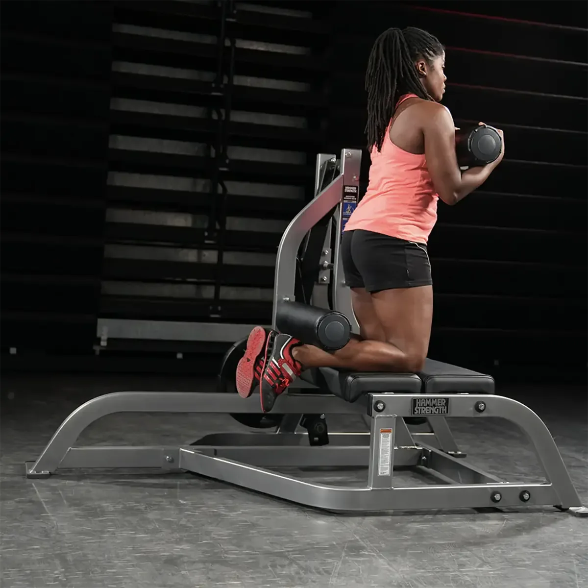 Hammer Strength Plate-loaded assisted Nordic ham machine for posterior chain training