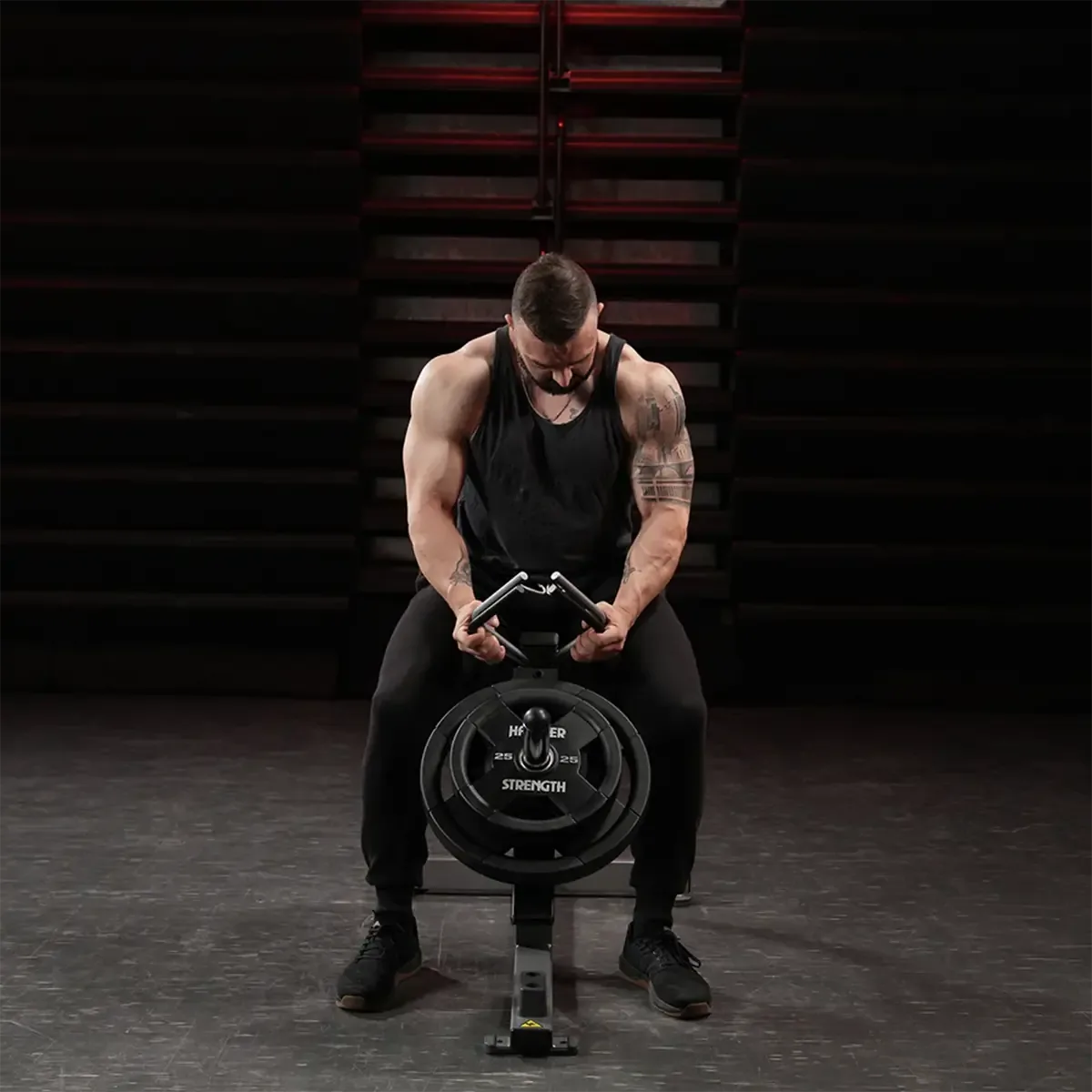 Hammer Strength grip trainer with forward-angled seat