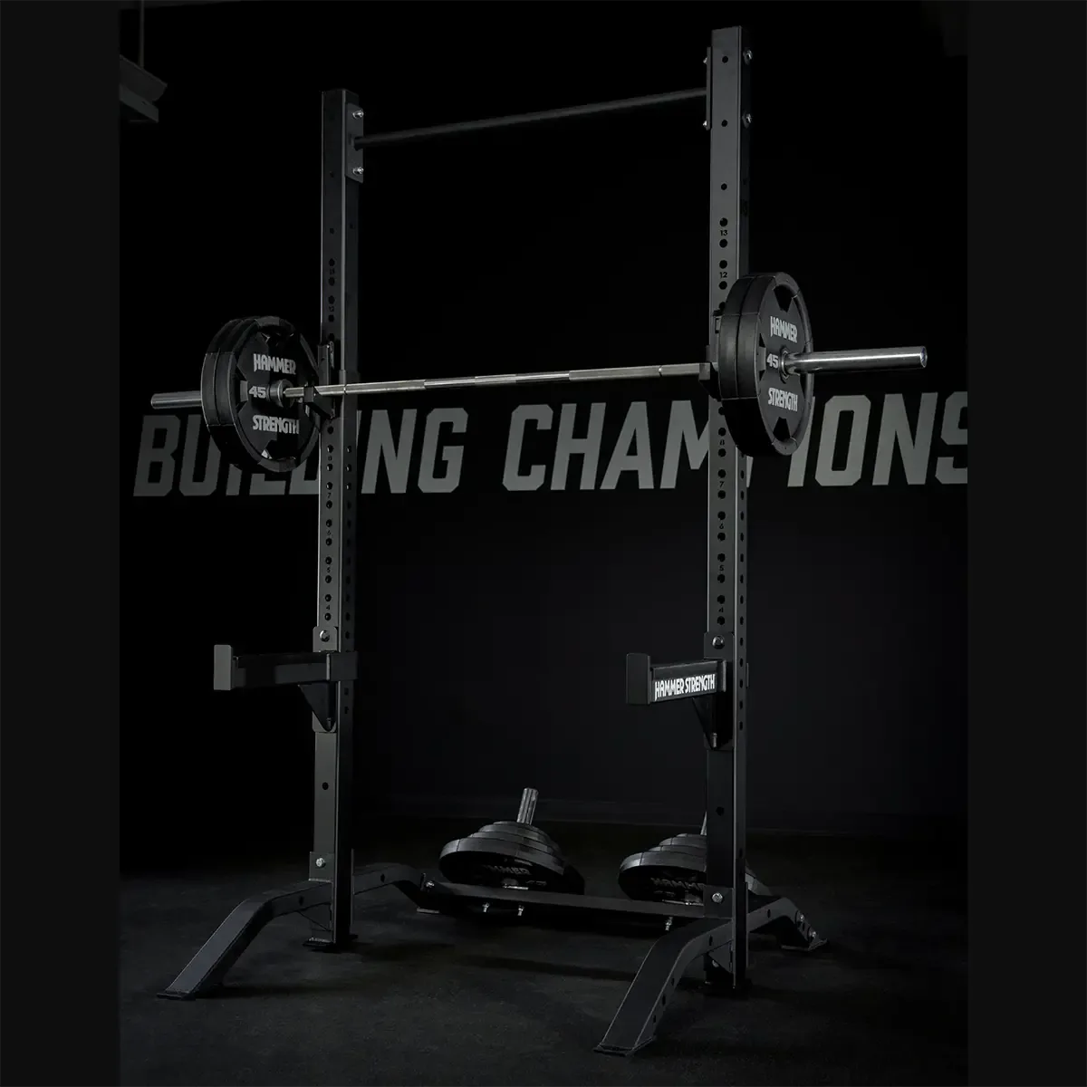 Hammer Strength HD ACharcoal squat stand with bar supports, bar catches, and weight horns