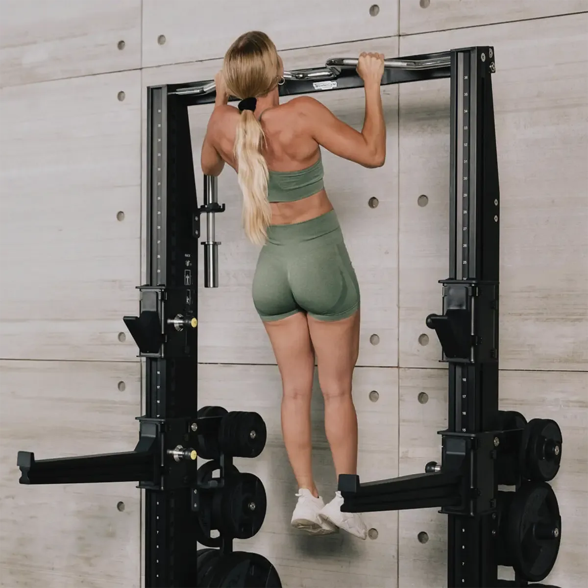 Technogym Personal Chrome strength training rack with pull-up bar and integrated storage supports