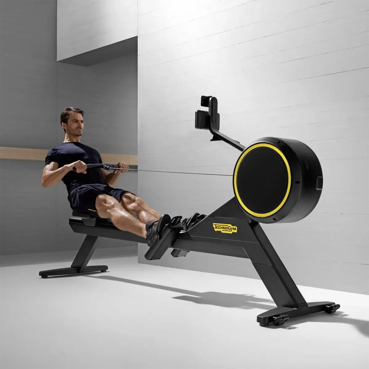 Technogym Skillrow Self-powered rowing machine with smartphone holder and black frame