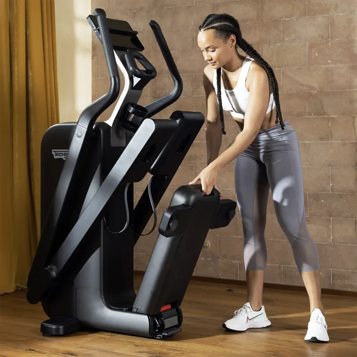 Technogym home elliptical with integrated device holder and compact frame