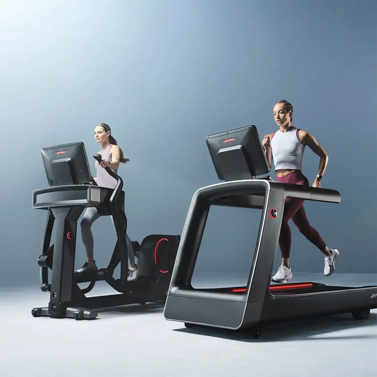 Front angle view of Life Fitness incline elliptical with smart lighting
