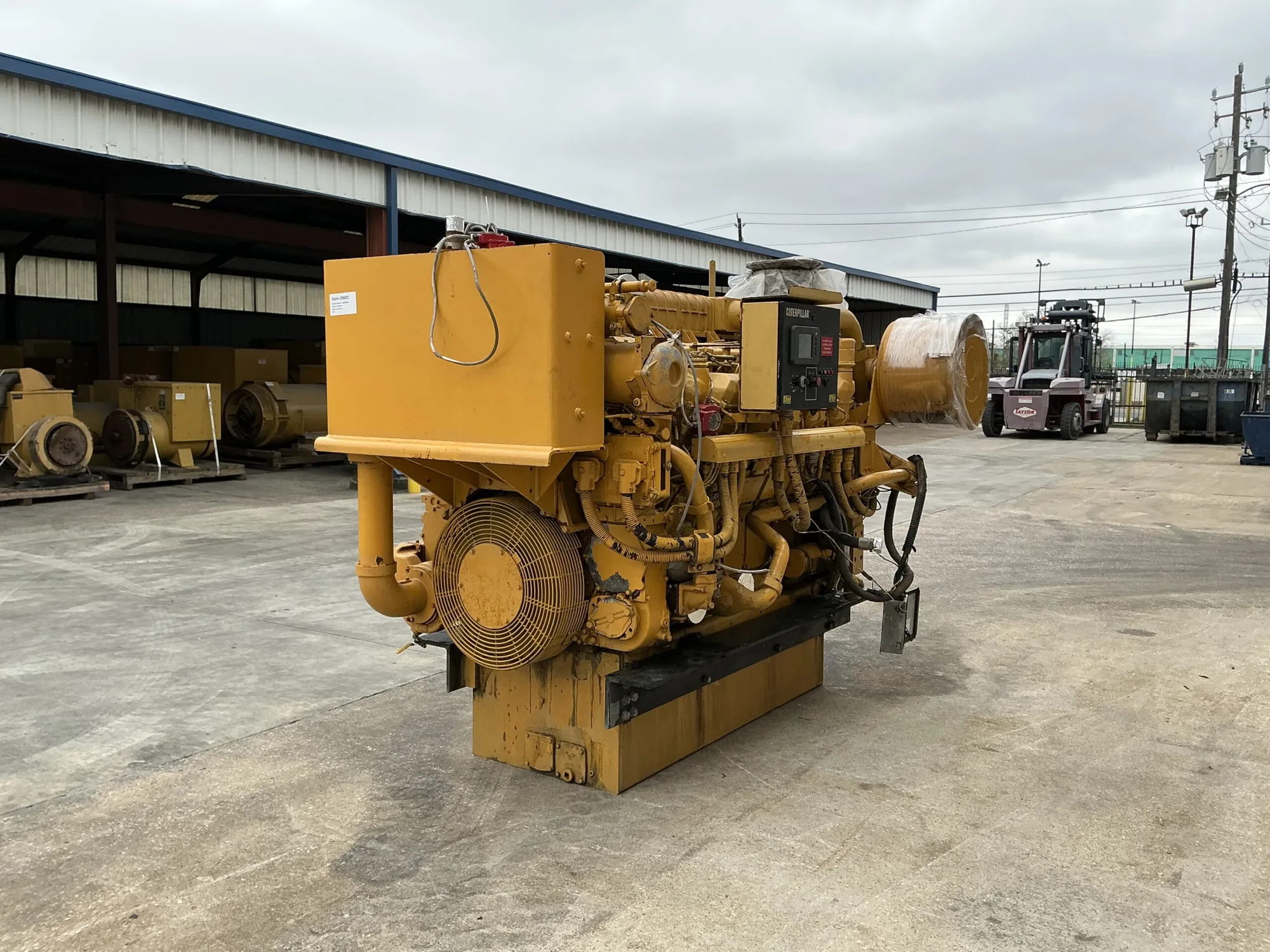 Caterpillar 3512B 1575HP Tier 1 diesel marine engine; yellow engine block with a black Caterpillar control panel