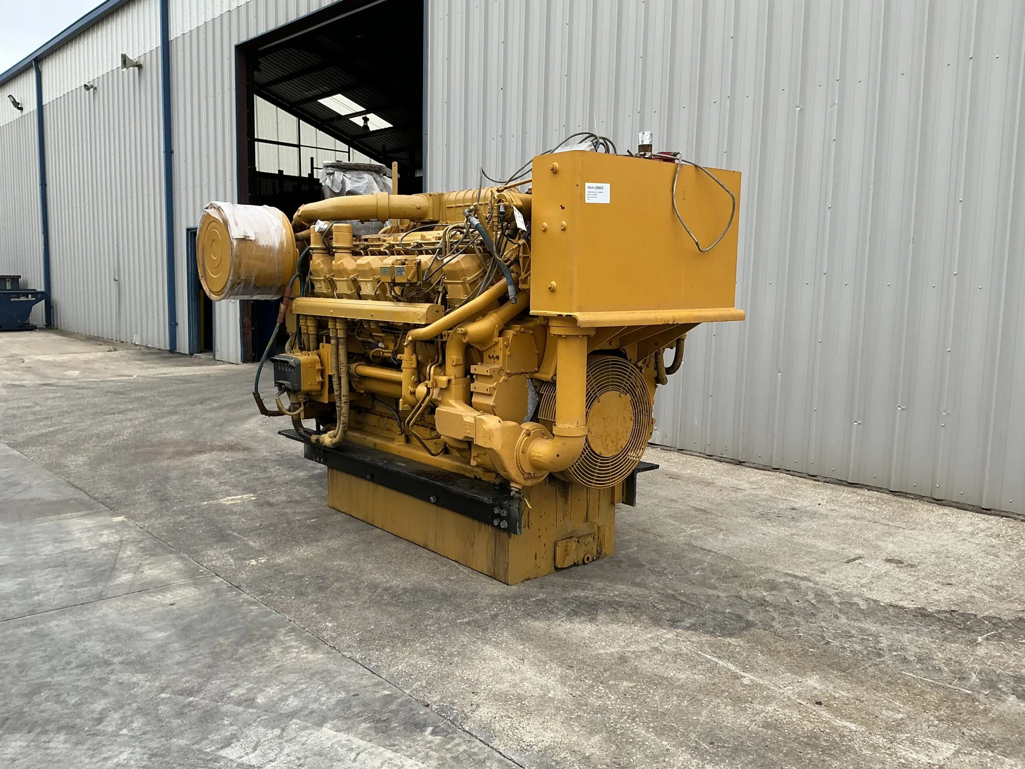 Caterpillar 3512B 1575HP Tier 1 diesel marine engine with yellow cabinet